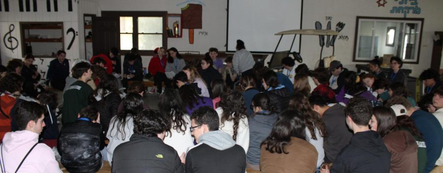 NFTY+board+and+participants+engage+in+a+musical+program+and+discuss+the+deeper+meaning+of+some+songs.+Photo+by+Sydney+Kraus.