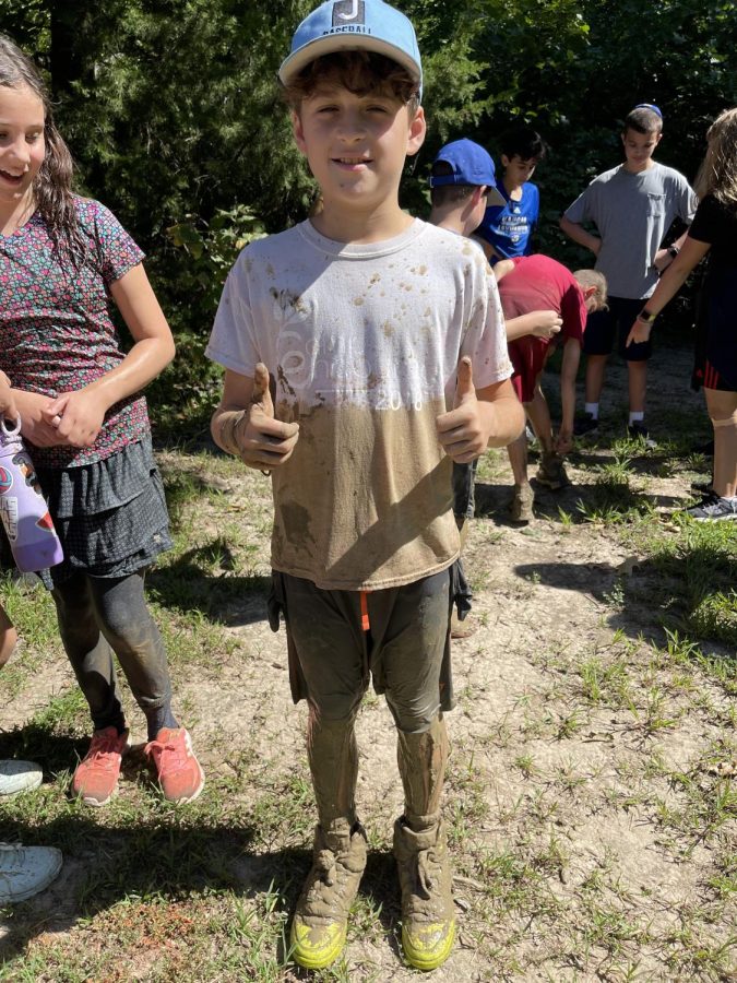 Gus Zitron was covered in mud after the fun Zip KC trip. Photo by Kristin Huston.