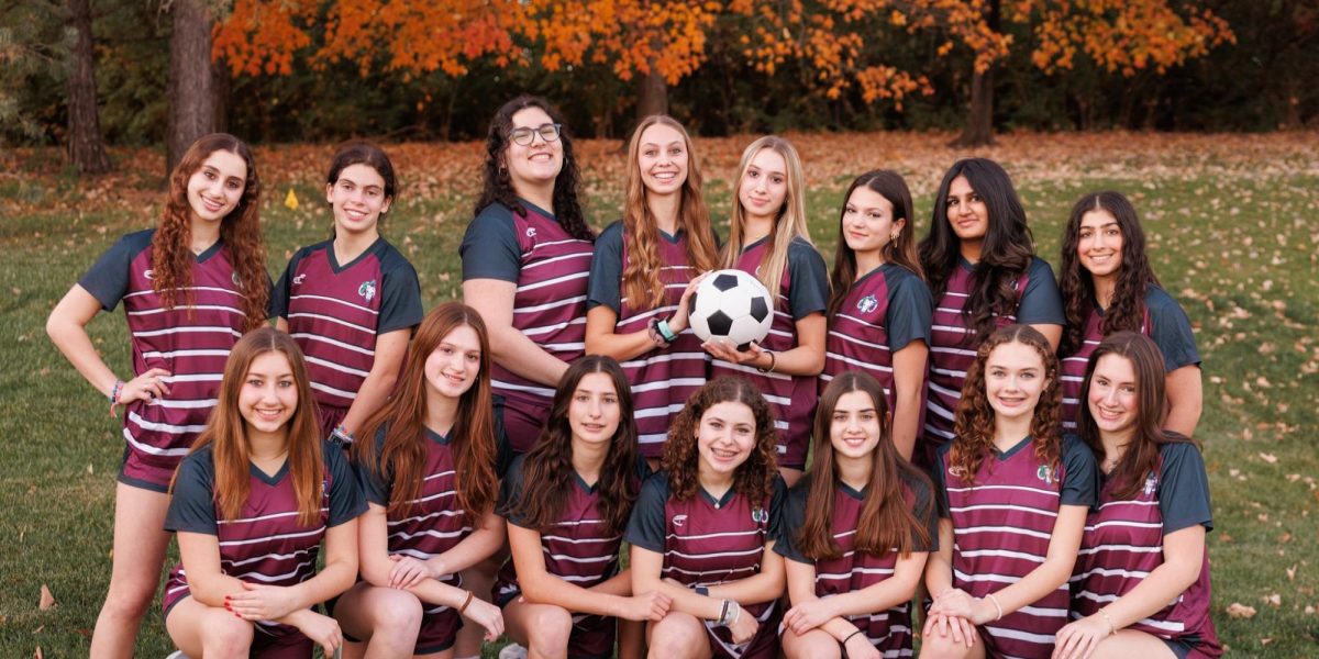 HBHA’s girls varsity girls soccer team poses together on media day. 