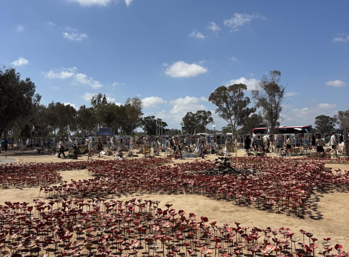 At the Nova Festival, now a memorial, there has been a flower placed for each person whom the Hamas terrorists killed. This memorial features a poster for each victim, displaying pictures of them and a tribute written by their family and/or friends. Photo taken by Ruby Sokol
